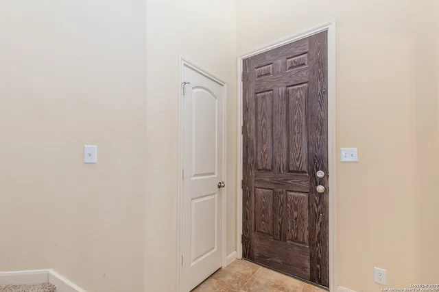 a view of a hallway with entryway