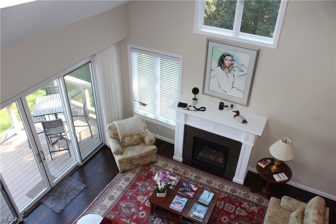 122 Turtle Bay Huron, OH 44839 - Photo 9 of 31 Living room featuring a towering ceiling and wood-type flooring