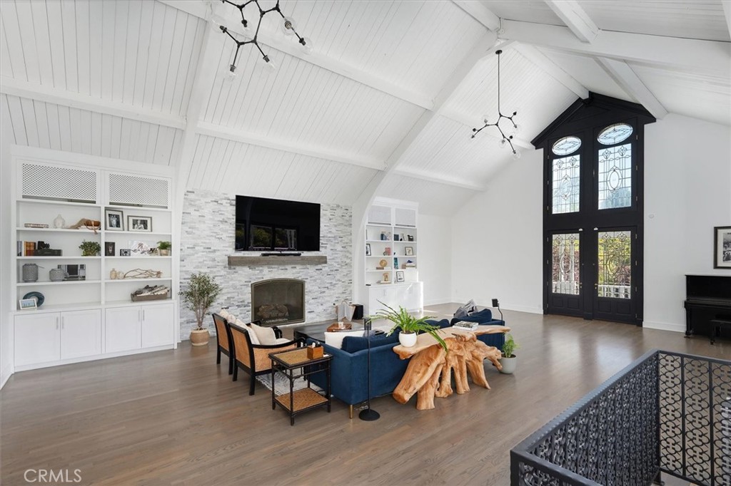 28933 Wagon Road Agoura Hills, CA 91301 - Photo 13 of 73 a living room with furniture and a flat screen tv