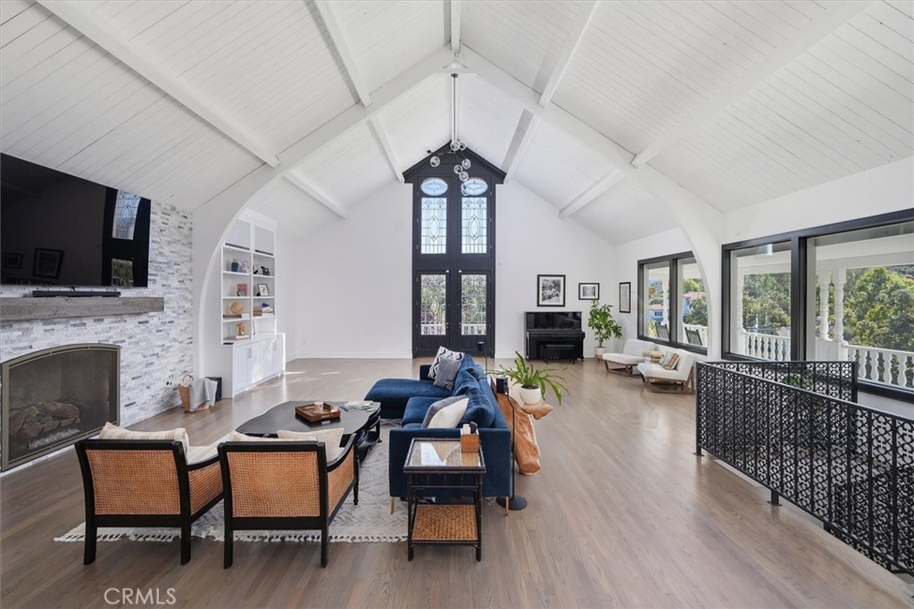 28933 Wagon Road Agoura Hills, CA 91301 - Photo 14 of 73 a living room with furniture fireplace and flat screen tv