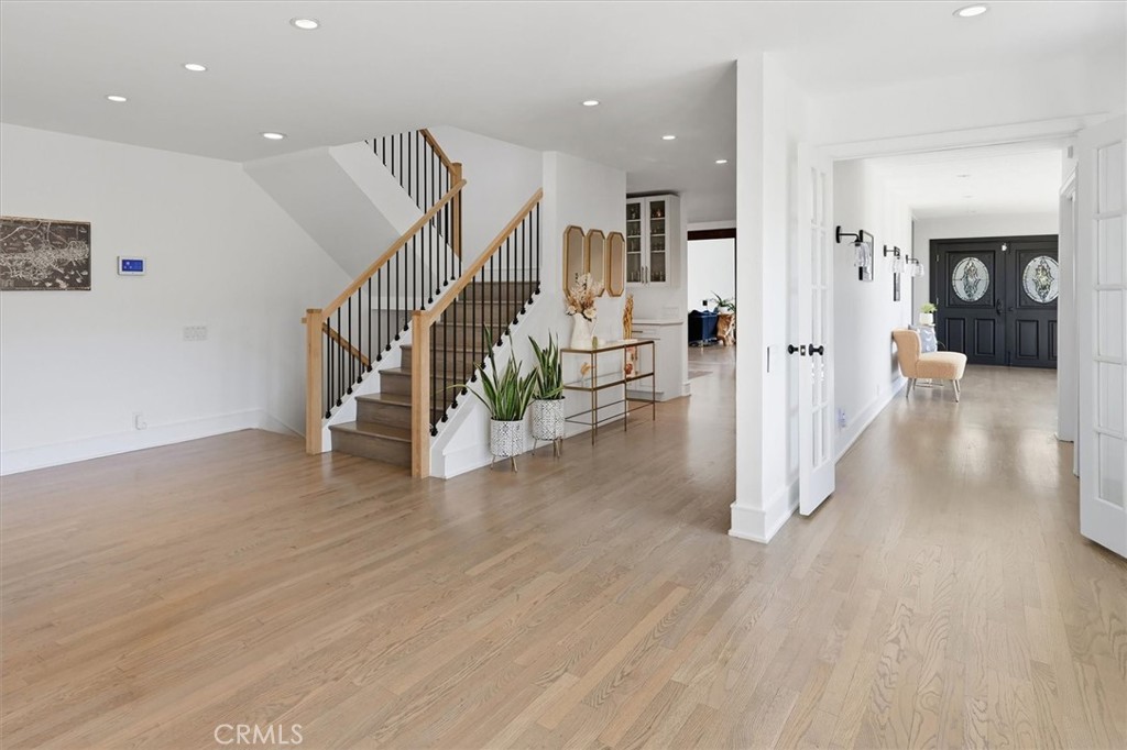 28933 Wagon Road Agoura Hills, CA 91301 - Photo 31 of 73 a view of a hallway with wooden floor and staircase