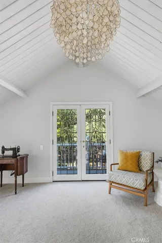 a bedroom with a bed and a television