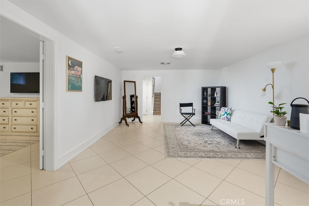 28933 Wagon Road Agoura Hills, CA 91301 - Photo 45 of 73 a living room with furniture and a flat screen tv
