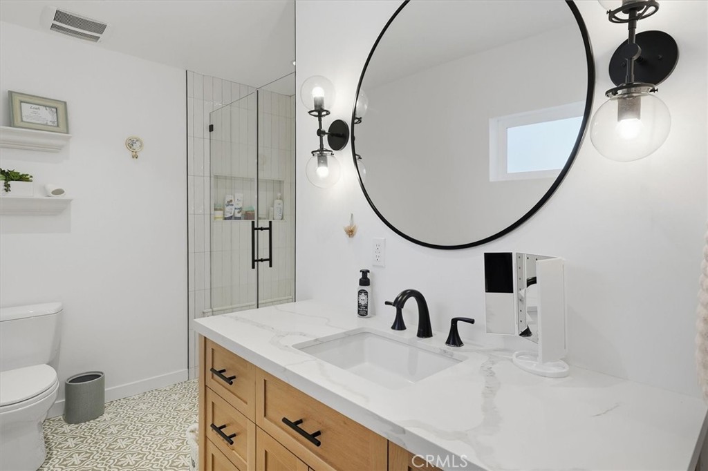 28933 Wagon Road Agoura Hills, CA 91301 - Photo 54 of 73 a bathroom with a sink and a mirror