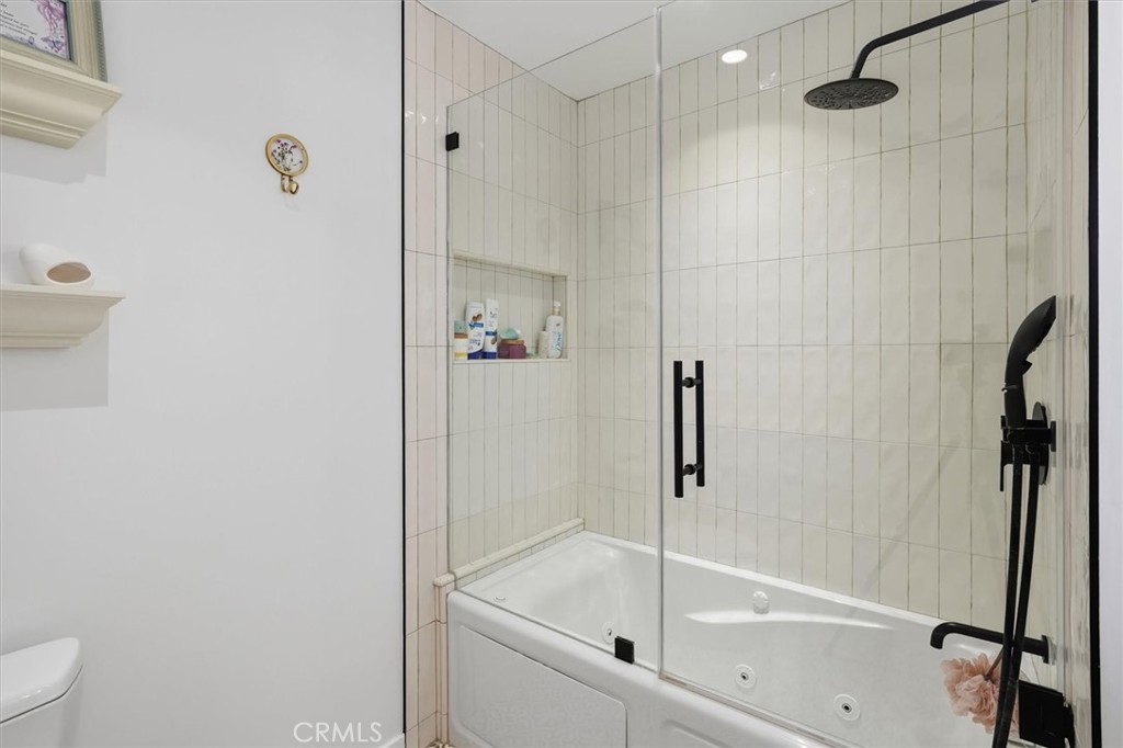 28933 Wagon Road Agoura Hills, CA 91301 - Photo 55 of 73 a bathroom with a bathtub and a shower