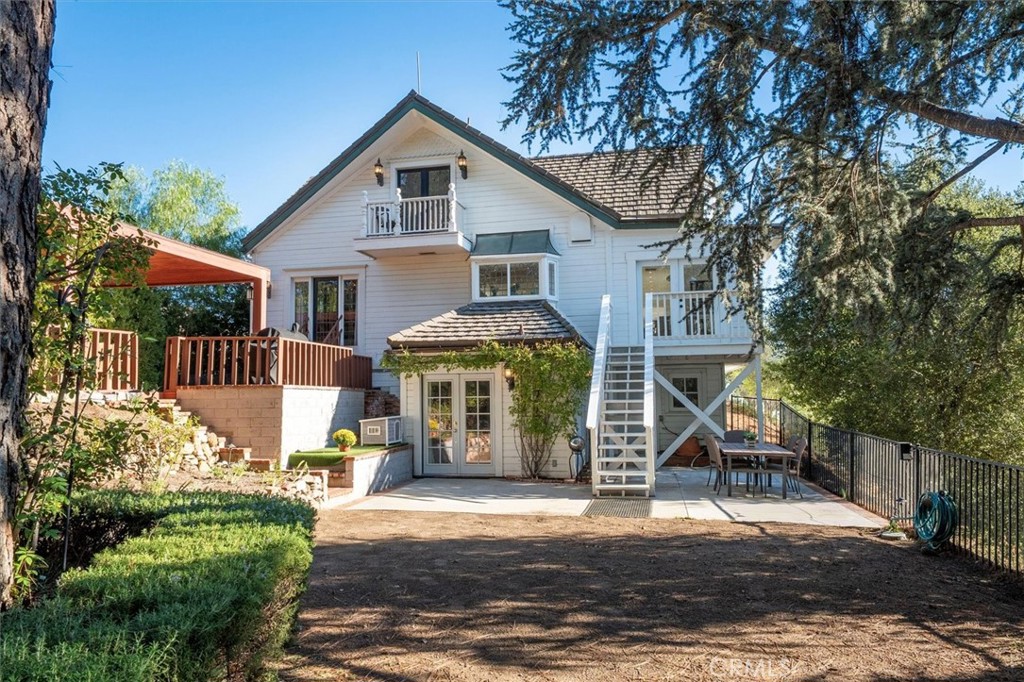 28933 Wagon Road Agoura Hills, CA 91301 - Photo 70 of 73 a front view of a house with a garden