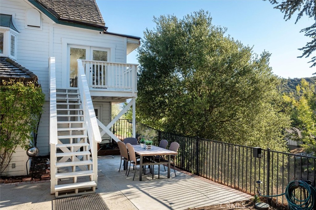 28933 Wagon Road Agoura Hills, CA 91301 - Photo 71 of 73 a view of a patio with a table and chairs