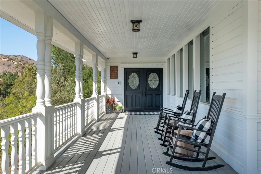 28933 Wagon Road Agoura Hills, CA 91301 - Photo 10 of 73 a view of a porch with furniture