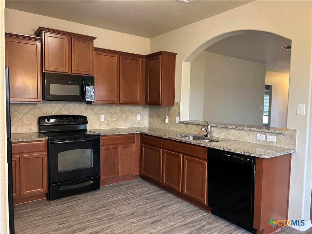 137 Bainbridge Road Temple, TX 76502 - Photo 11 of 26 a kitchen with a sink stove and microwave