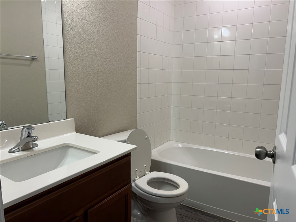 137 Bainbridge Road Temple, TX 76502 - Photo 24 of 26 a bathroom with a sink and a mirror