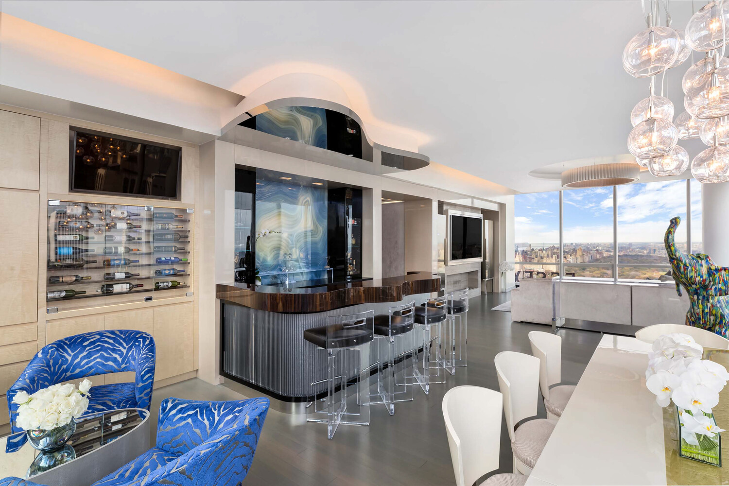 157 West 57th Street, Unit 53B Manhattan, NY 10019 - Photo 6 of 27 a living room with furniture and a large window