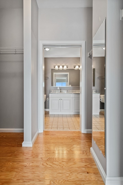 36 Village Road, Unit 404 Middleton, MA 01949 - Photo 21 of 41 a view of a living room with a wooden floor