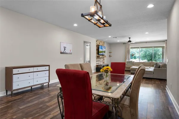 a view of a dining room with furniture window and wooden floor