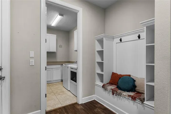 a kitchen with a refrigerator and a stove