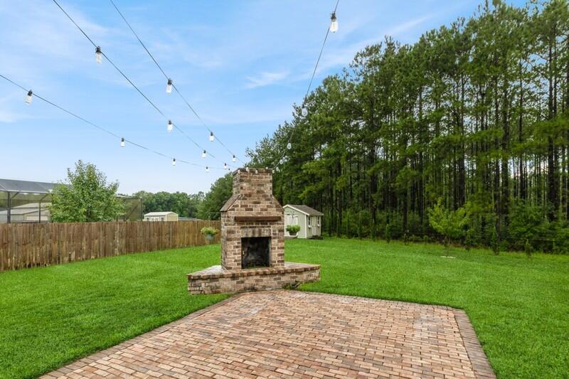 a view of a chair and table in the garden