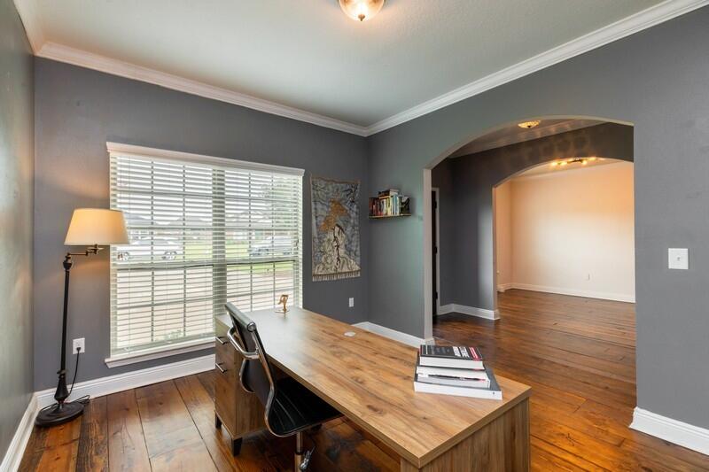 3362 Citrine Circle Crestview, FL 32539 - Photo 16 of 42 a view of a workspace with furniture and wooden floor