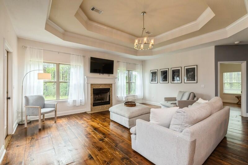 3362 Citrine Circle Crestview, FL 32539 - Photo 25 of 42 a living room with furniture a fireplace and a flat screen tv