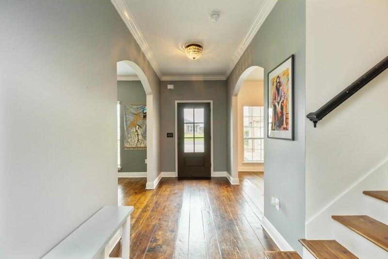 3362 Citrine Circle Crestview, FL 32539 - Photo 28 of 42 a view of hallway with wooden floor and stairs