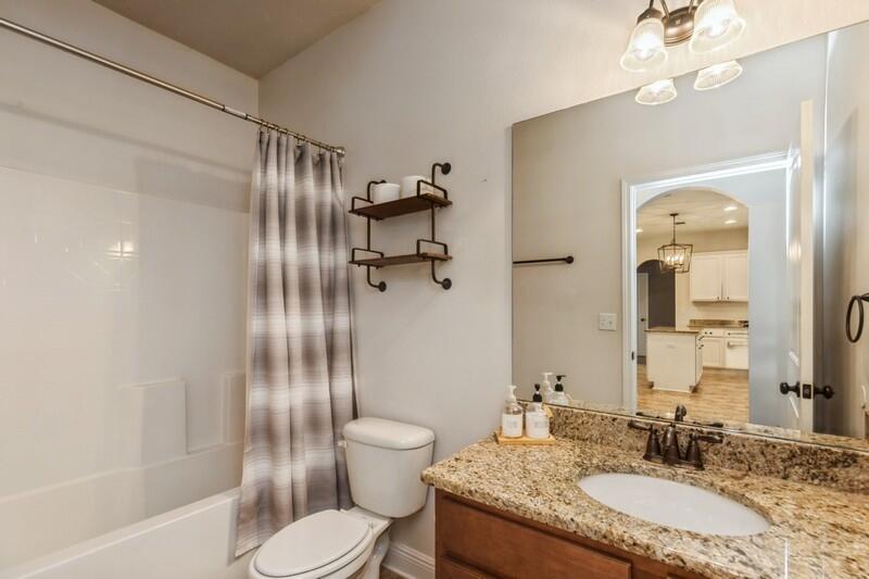 3362 Citrine Circle Crestview, FL 32539 - Photo 33 of 42 a bathroom with a granite countertop sink toilet and shower