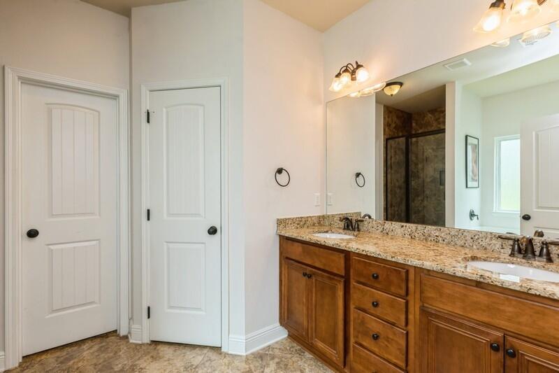 3362 Citrine Circle Crestview, FL 32539 - Photo 36 of 42 a bathroom with a granite countertop sink and a mirror
