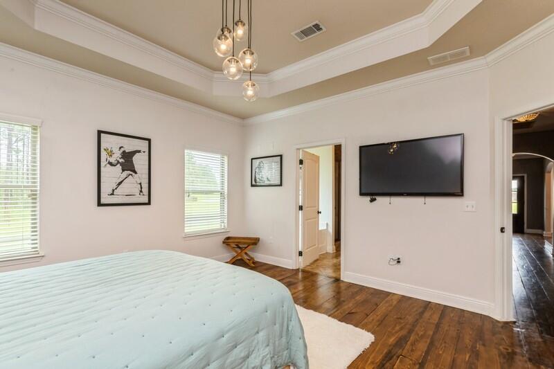 3362 Citrine Circle Crestview, FL 32539 - Photo 40 of 42 a bedroom with a bed and a flat screen tv