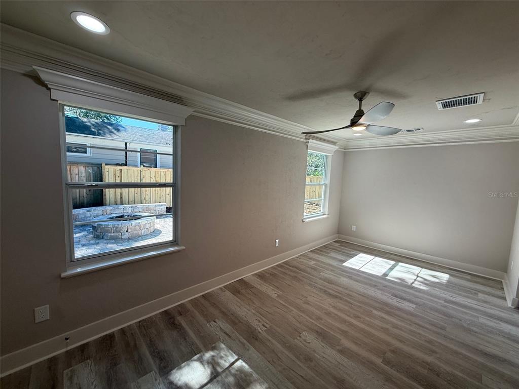 1217 Northeast 4 Street Gainesville, FL 32601 - Photo 15 of 36 a view of an empty room with wooden floor and a window