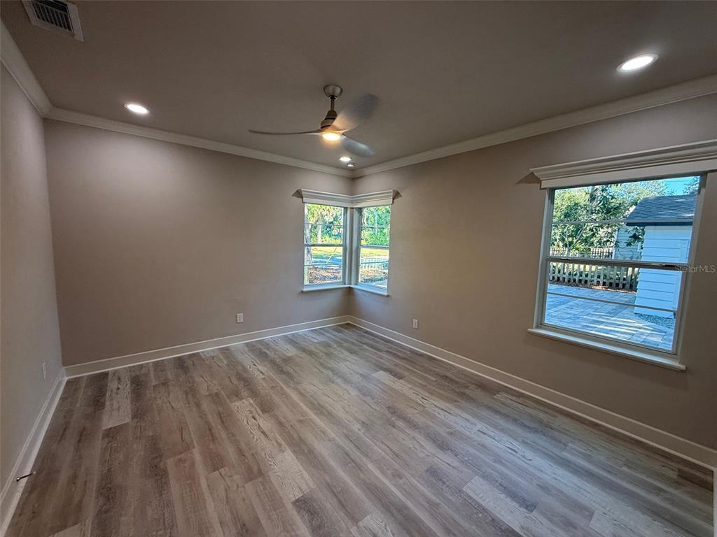 1217 Northeast 4 Street Gainesville, FL 32601 - Photo 18 of 36 an empty room with windows