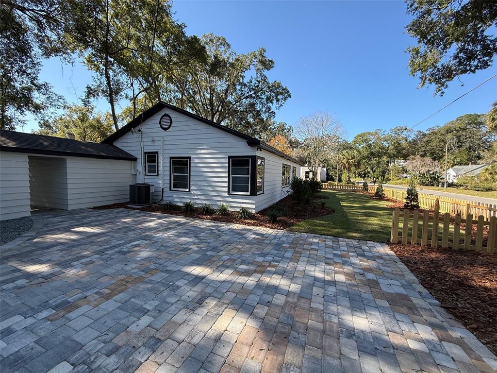 1217 Northeast 4 Street Gainesville, FL 32601 - Photo 27 of 36 a view of a house with a backyard