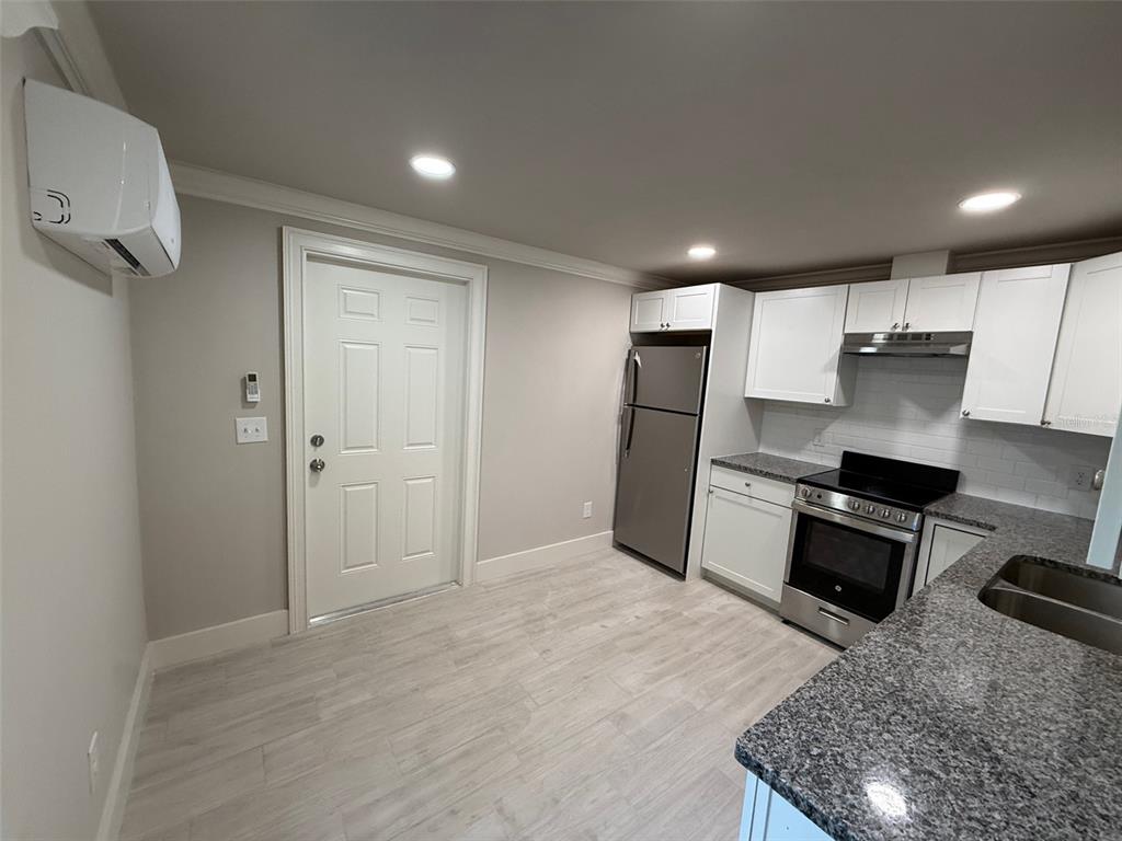 1217 Northeast 4 Street Gainesville, FL 32601 - Photo 31 of 36 a kitchen with a refrigerator and a sink
