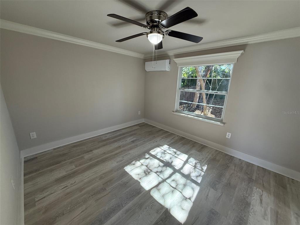 1217 Northeast 4 Street Gainesville, FL 32601 - Photo 32 of 36 a view of an empty room and window