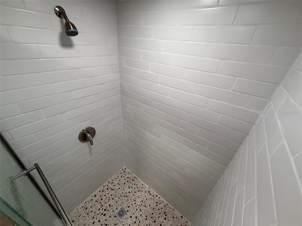 1217 Northeast 4 Street Gainesville, FL 32601 - Photo 35 of 36 a bathroom with a shower