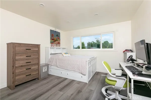 a room with furniture and a flat screen tv