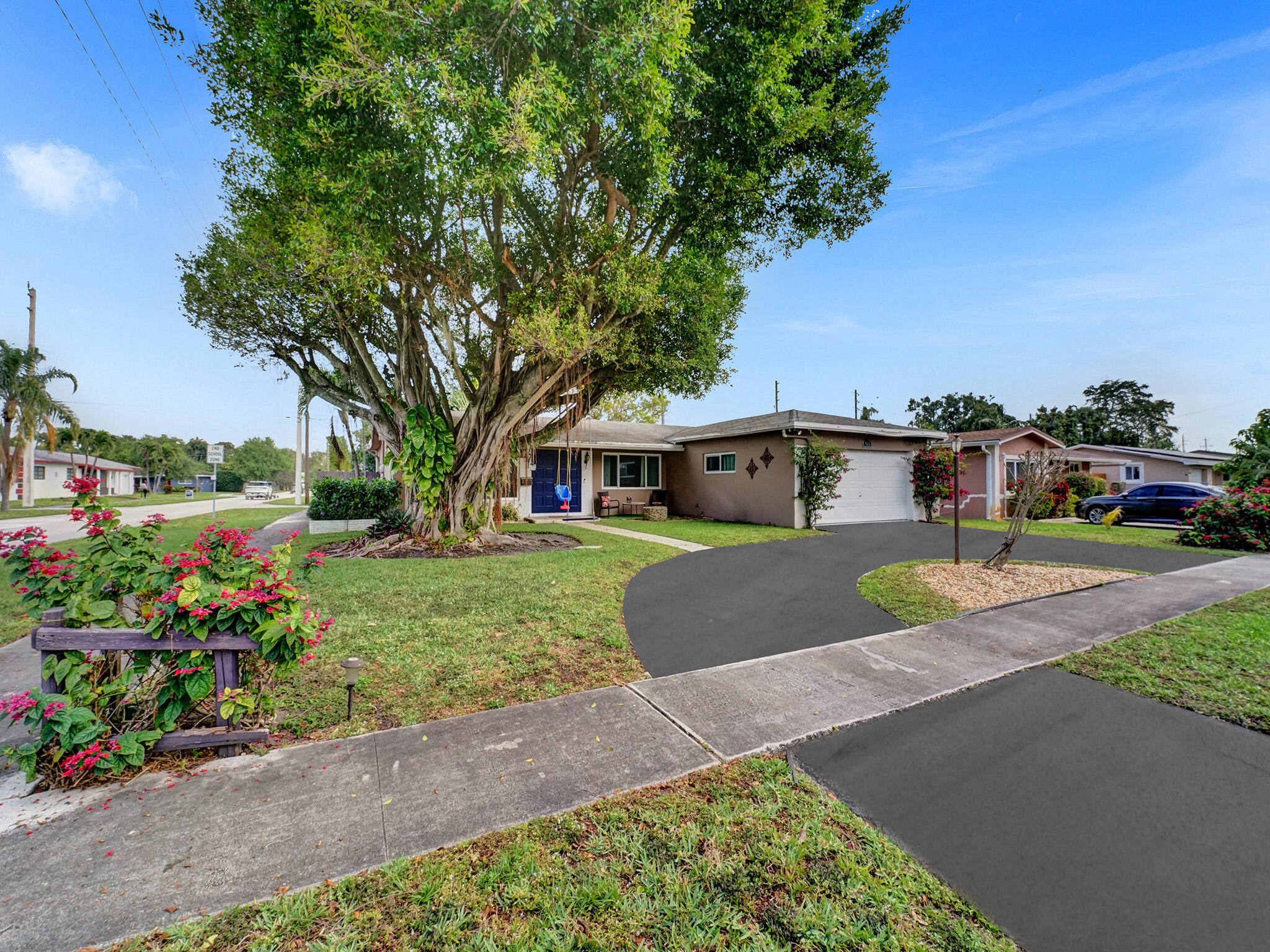 4533 Jefferson Street Hollywood, FL 33021 - Photo 1 of 29 a front view of a house with a yard