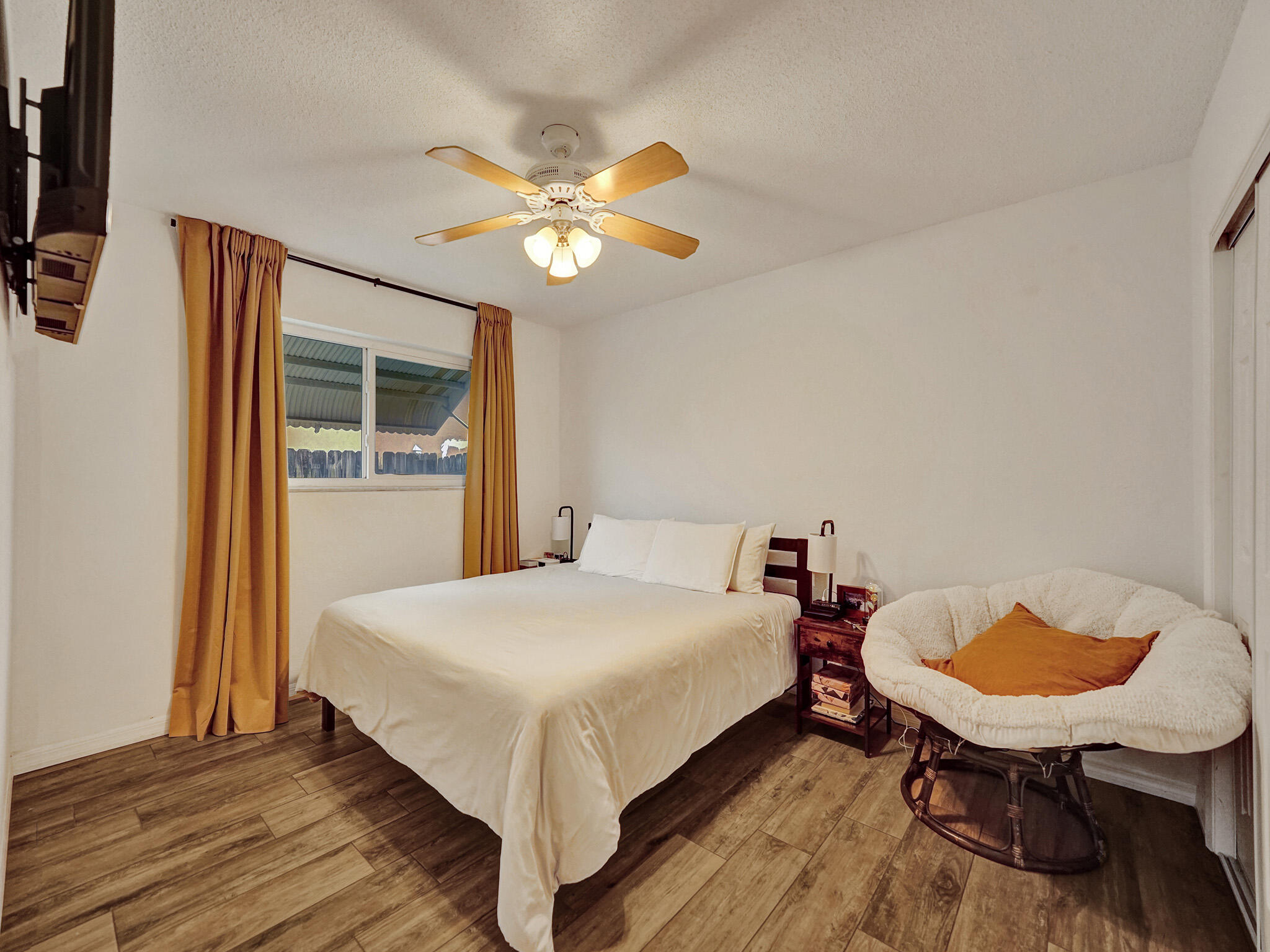 4533 Jefferson Street Hollywood, FL 33021 - Photo 15 of 29 a bedroom with a bed and a chandelier