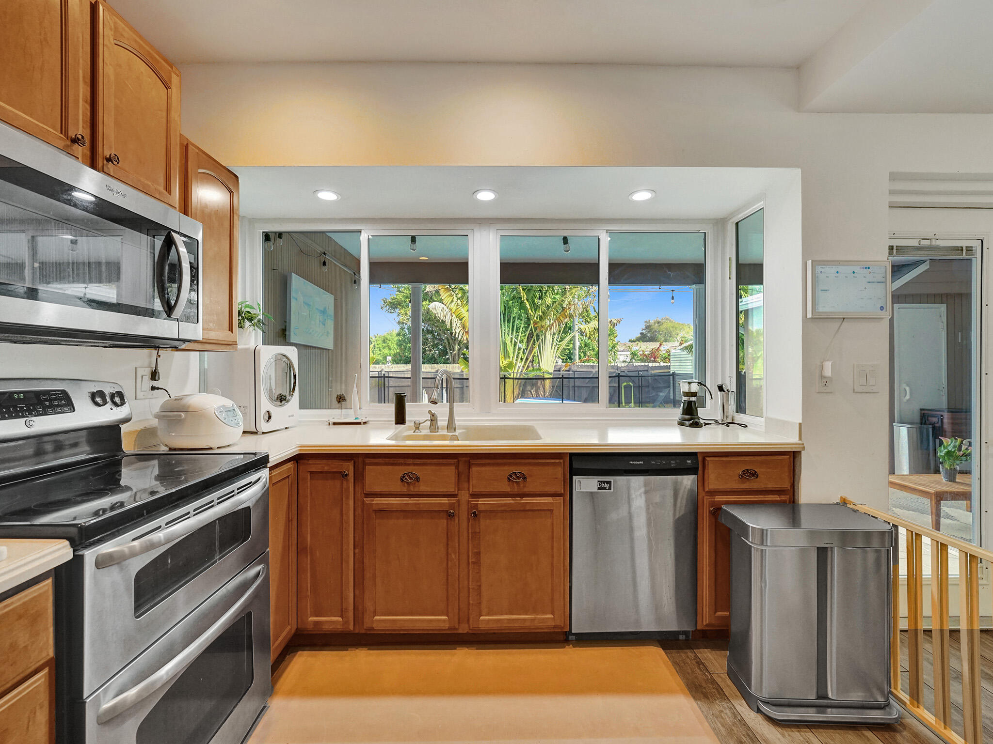 4533 Jefferson Street Hollywood, FL 33021 - Photo 17 of 29 a kitchen with a sink stove and cabinets
