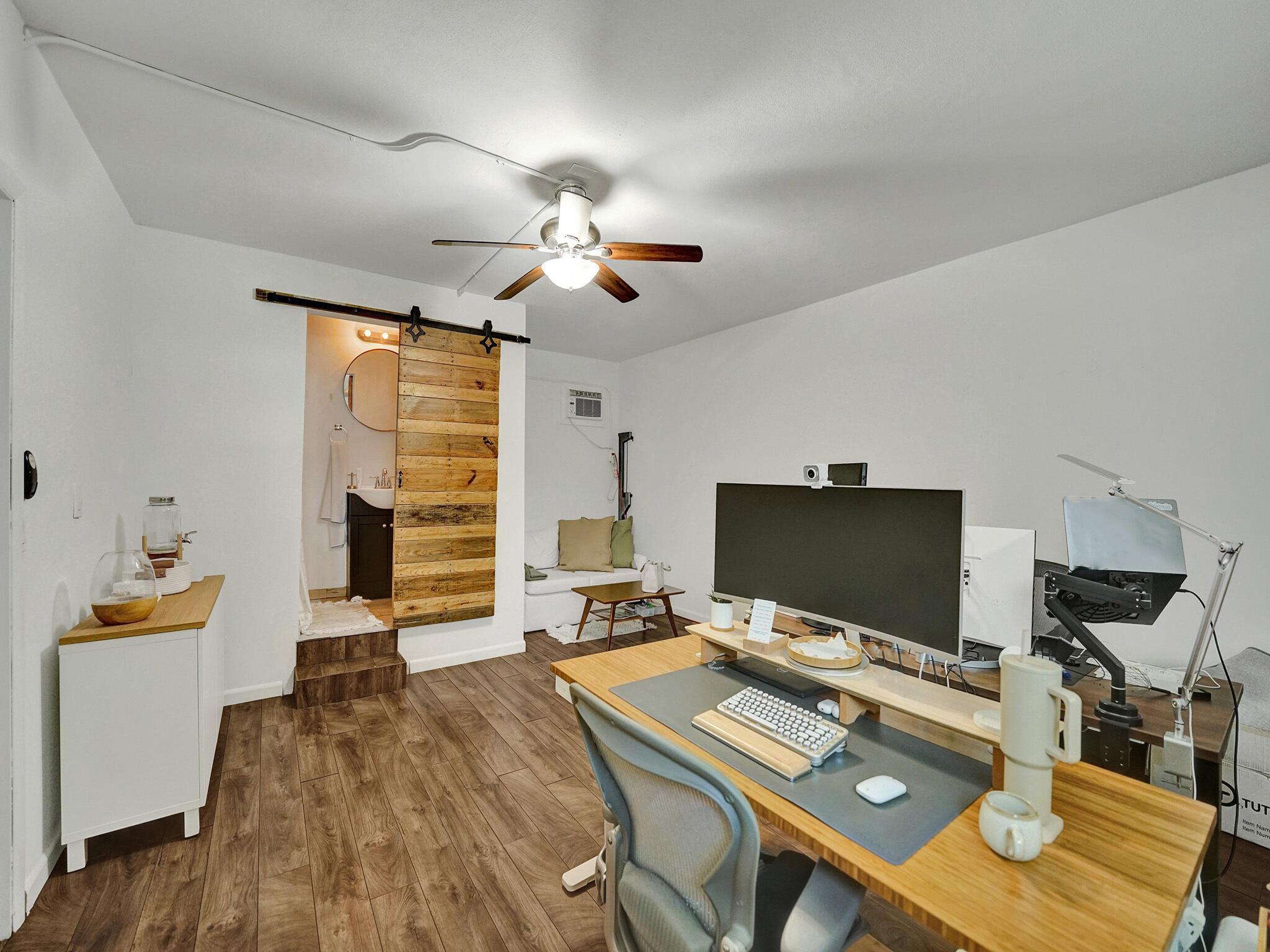 4533 Jefferson Street Hollywood, FL 33021 - Photo 20 of 29 a view of a workspace with furniture and a flat screen tv
