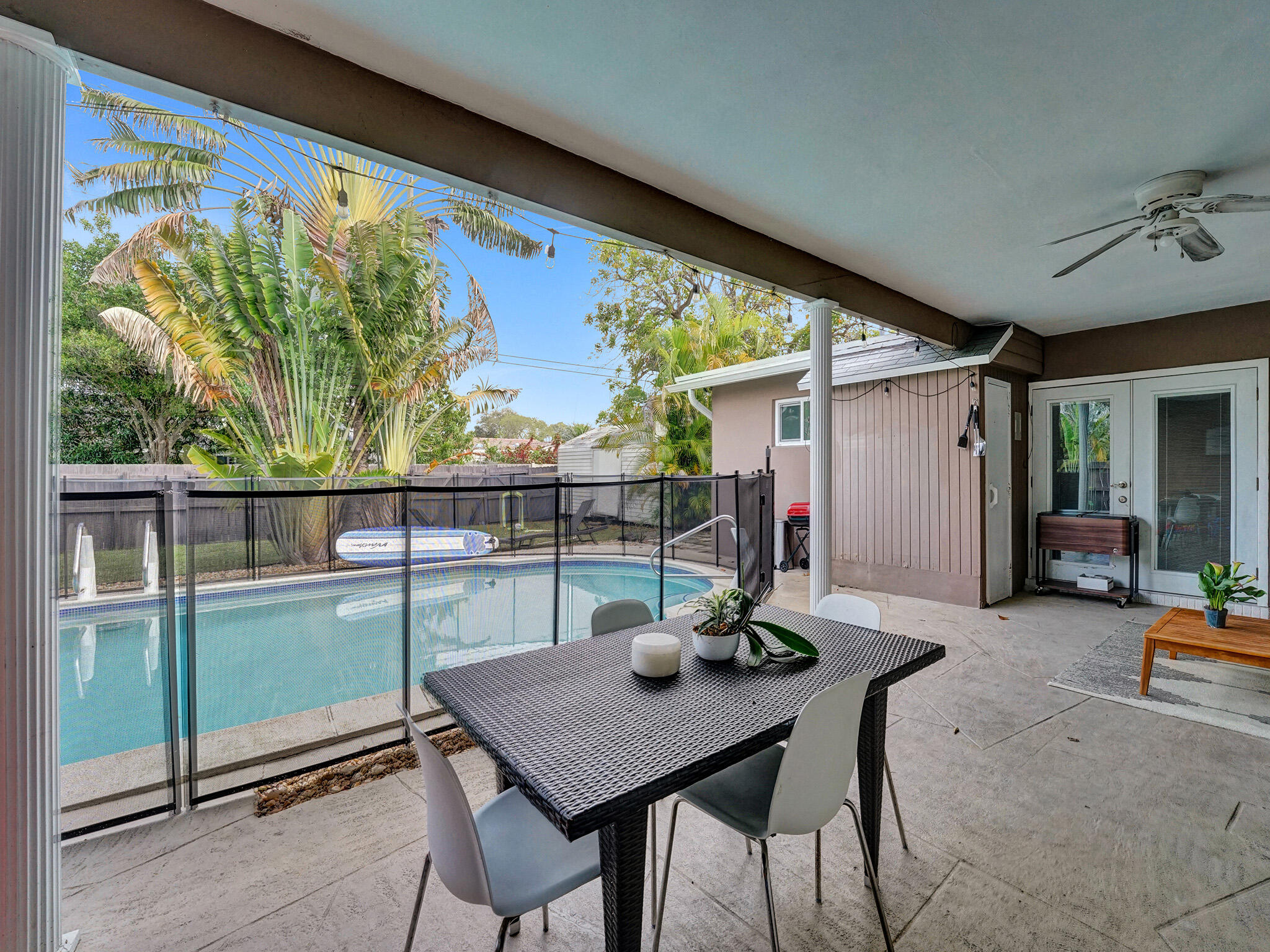 4533 Jefferson Street Hollywood, FL 33021 - Photo 25 of 29 a view of a patio with a table chairs and a backyard