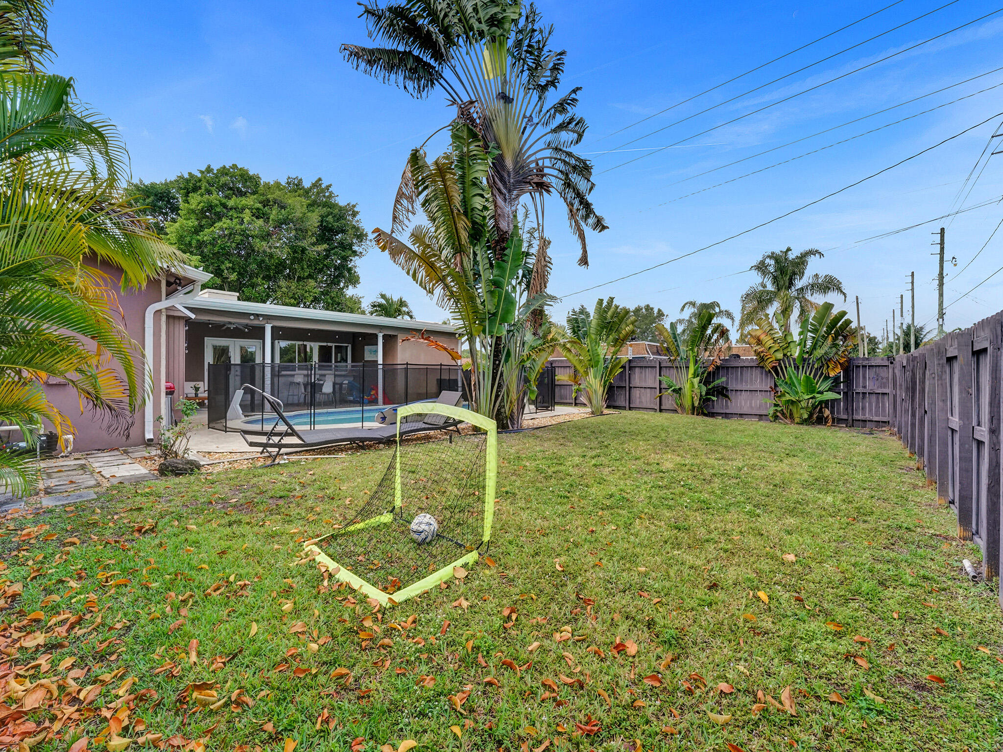 4533 Jefferson Street Hollywood, FL 33021 - Photo 29 of 29 a view of house with backyard and swimming pool