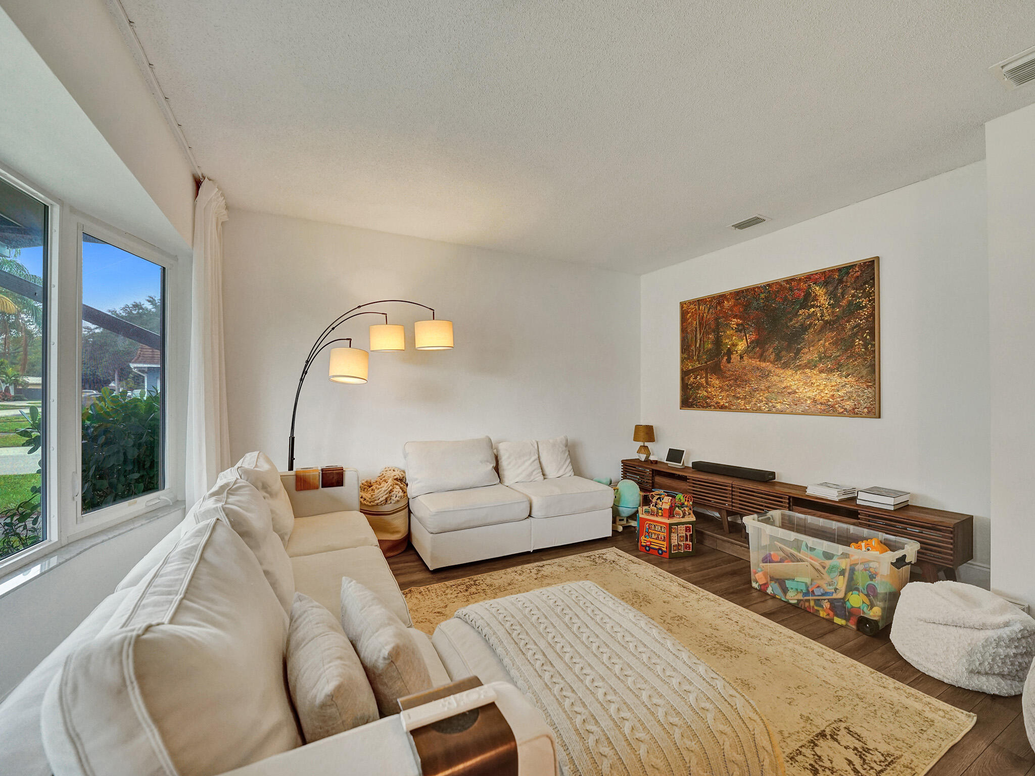 4533 Jefferson Street Hollywood, FL 33021 - Photo 3 of 29 a living room with furniture and a large window