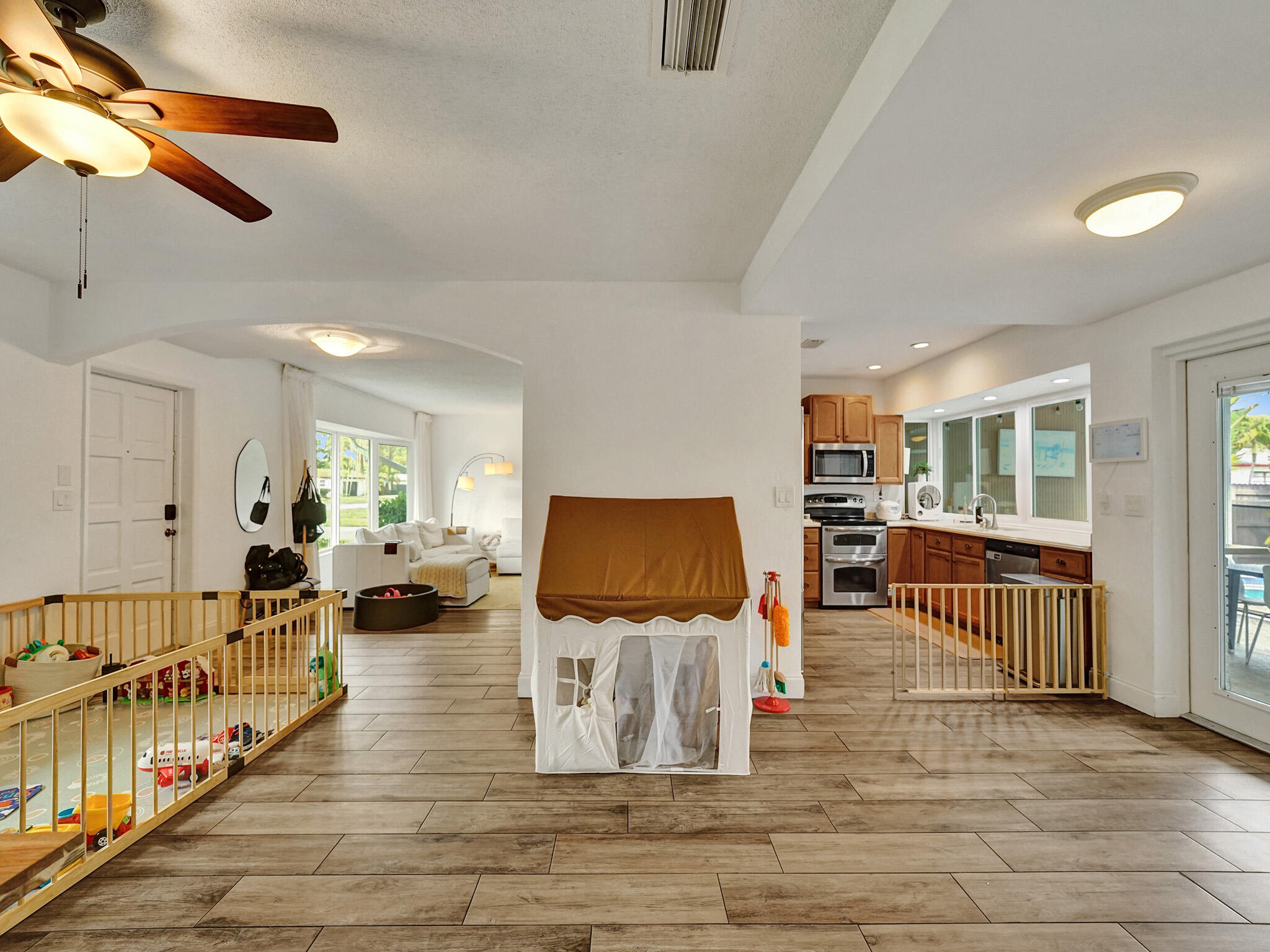 4533 Jefferson Street Hollywood, FL 33021 - Photo 5 of 29 a living room with furniture and a flat screen tv