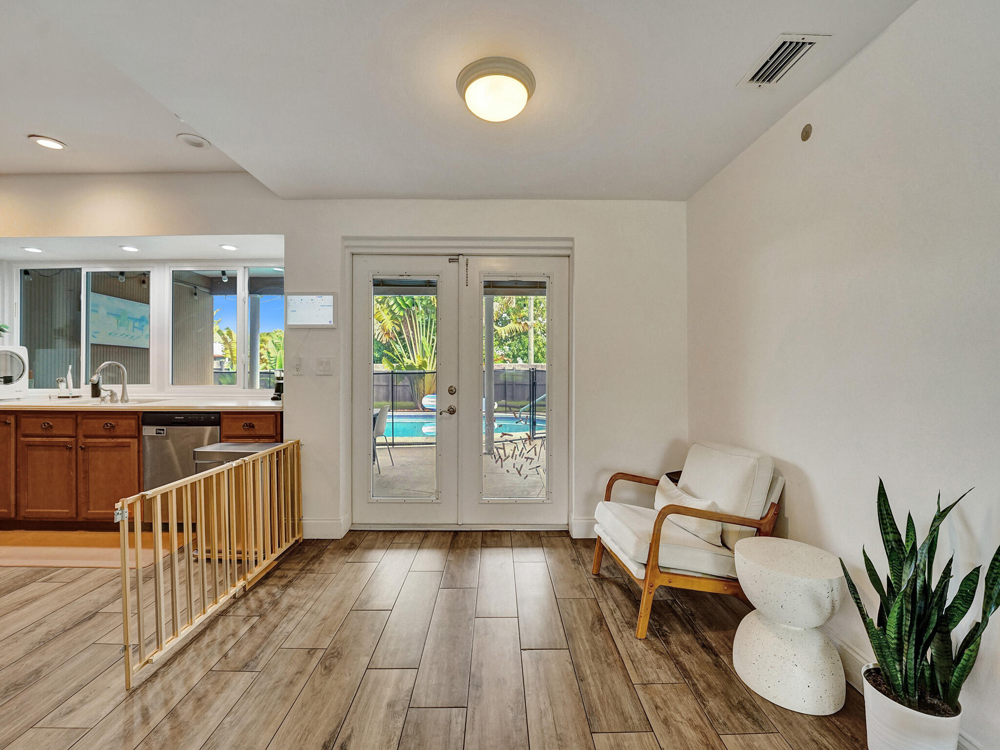 4533 Jefferson Street Hollywood, FL 33021 - Photo 6 of 29 a view of a room with wooden floor and furniture