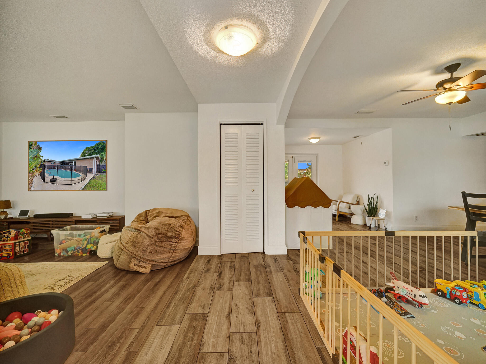 4533 Jefferson Street Hollywood, FL 33021 - Photo 8 of 29 a bedroom with furniture and a window