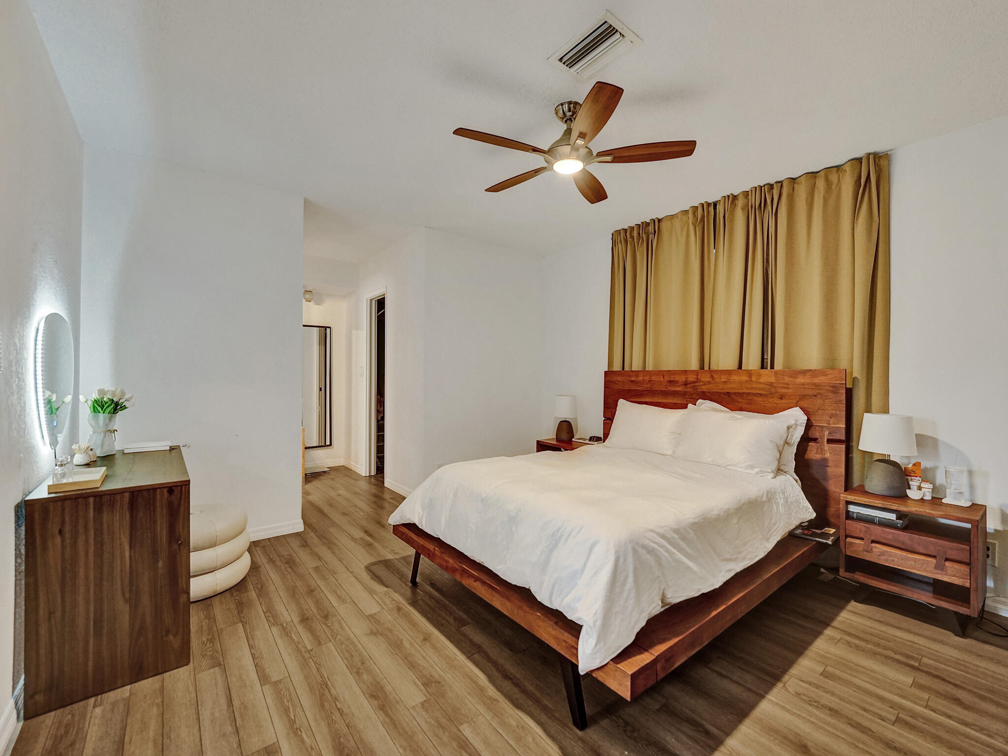 4533 Jefferson Street Hollywood, FL 33021 - Photo 10 of 29 a large bed sitting in a bedroom next to a window