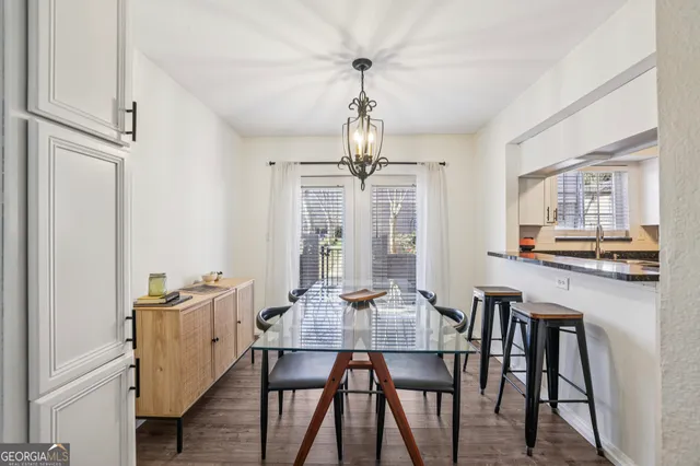 a view of a dining room with furniture and wooden floor