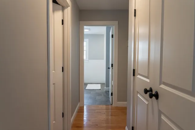 a view of a bathroom from a hallway
