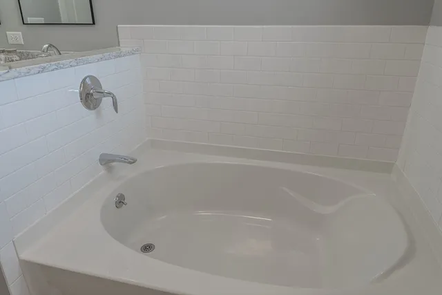 a close view of a bathtub in bathroom