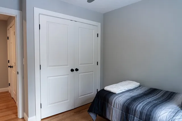 a bedroom with a bed and a hallway