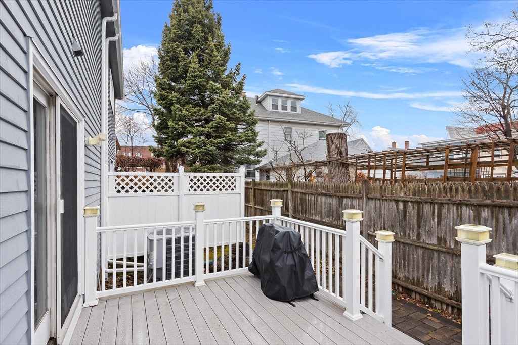 2 Chase Lane, Unit 2 Lynn, MA 01902 - Photo 20 of 42 a view of a balcony with wooden floor and fence
