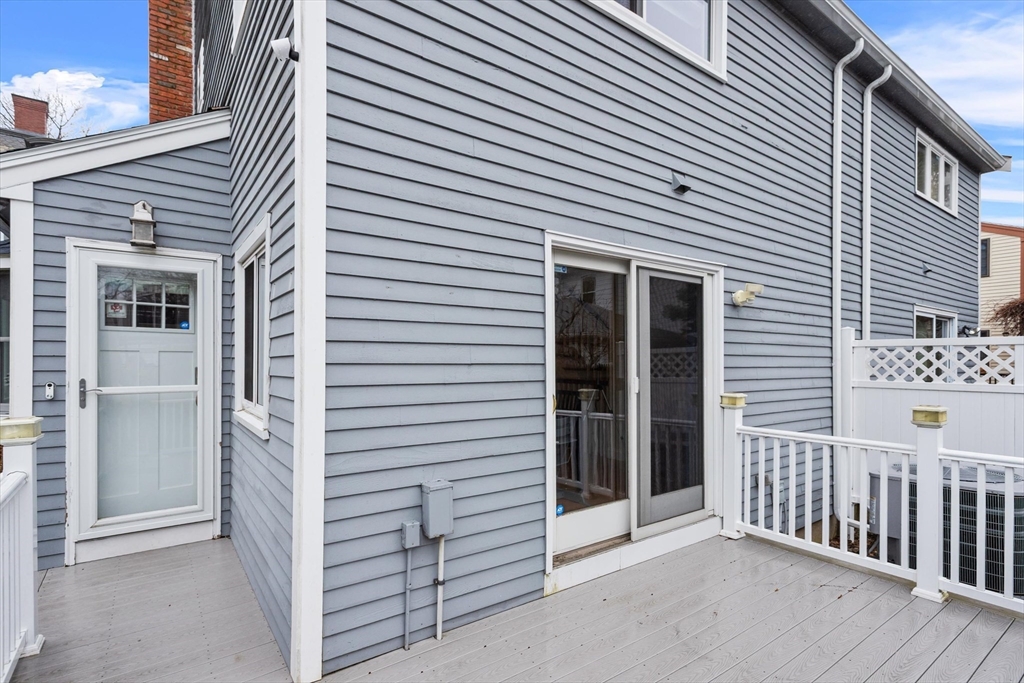 2 Chase Lane, Unit 2 Lynn, MA 01902 - Photo 21 of 42 a view of a house with a balcony