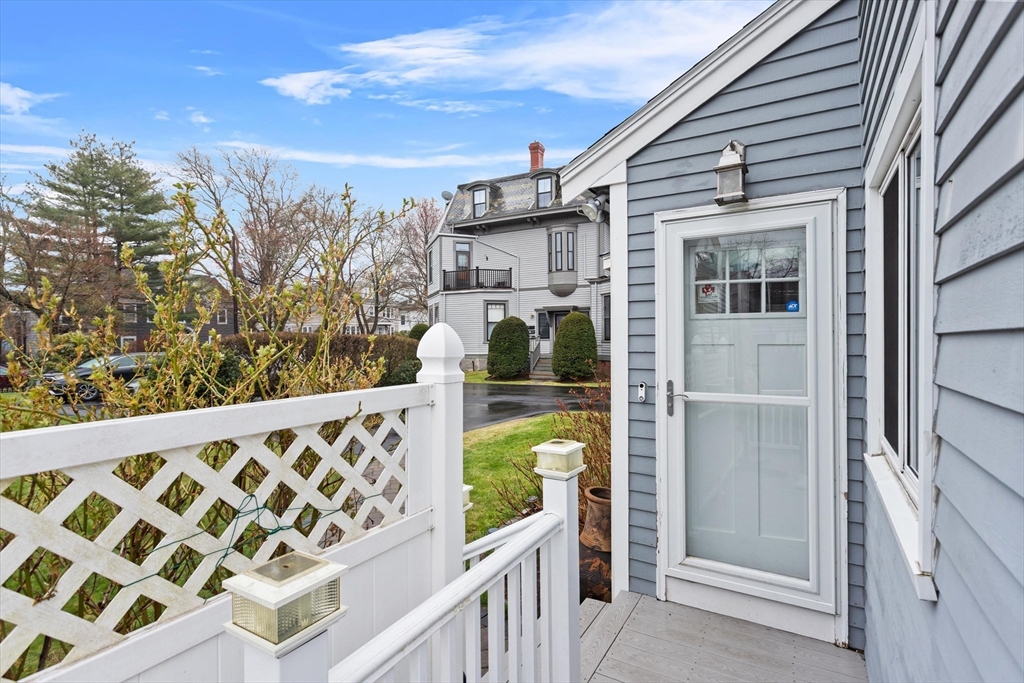 2 Chase Lane, Unit 2 Lynn, MA 01902 - Photo 24 of 42 a view of a small house with wooden fence